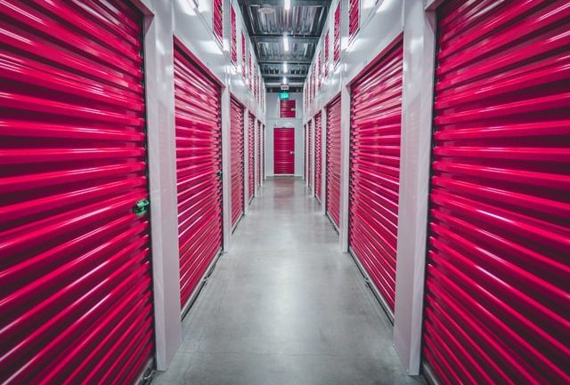 Alt-tag: A storage facility with units with red doors. 