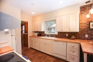 Castle Building & Remodeling, Inc. - Twin Cities Design / Build Firm | Kitchen refresh brick backsplash painted white cabinets