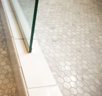 Shower door and tiled floor detail
