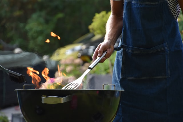 A man and a barbeque. 